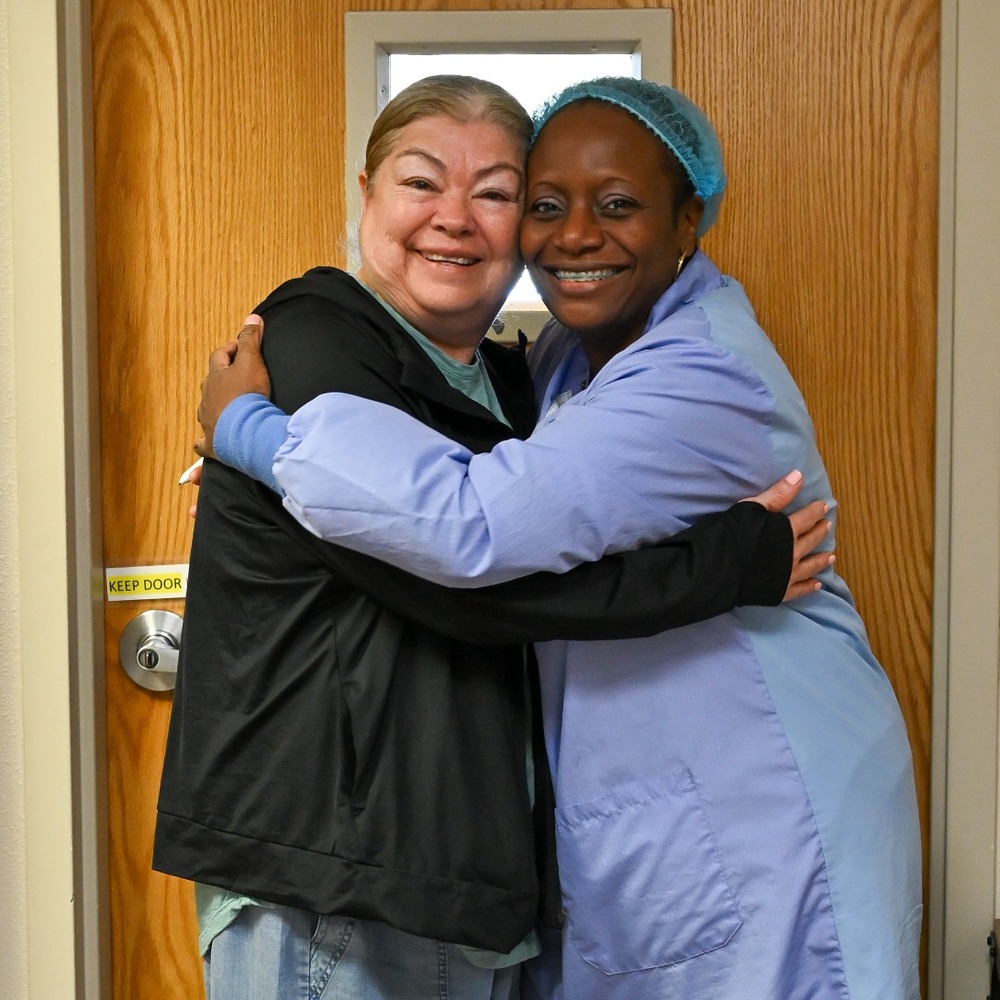dental-hygienist-sabrina-patient-1000x1000 Dental hygienist Sabrina shares a warm moment with a patient at The Neighborhood Christian Clinic.