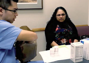 Woman getting prescribed medications